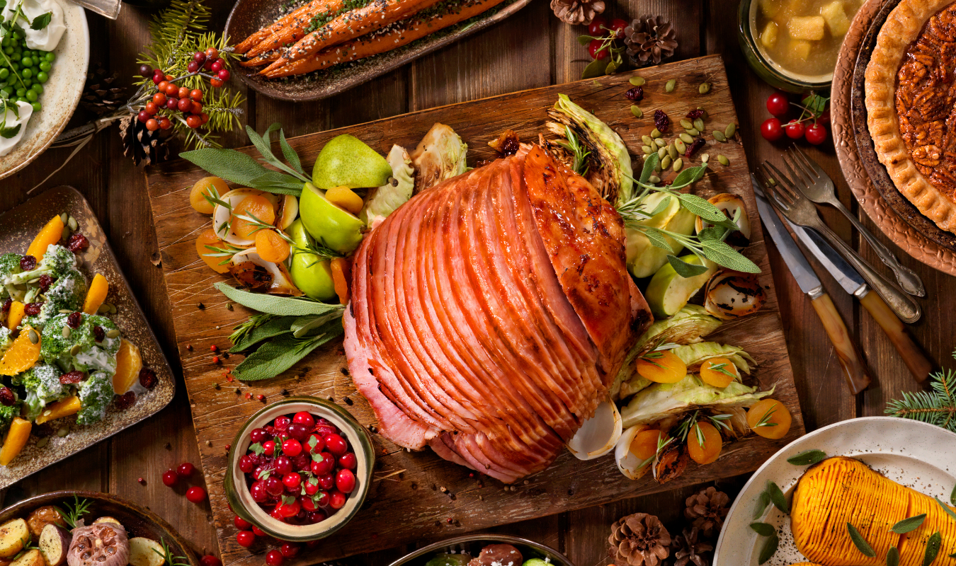 Glazed holiday ham with seasonal sides